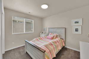 Bedroom featuring carpet flooring