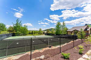 View of tennis/pickleball court with a mountain view