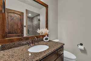 Bathroom with vanity and a stall shower