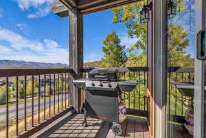 Deck featuring a mountain view and grilling area