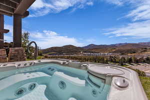 Exterior view of a mountain backdrop and a jacuzzi