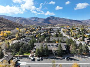 Aerial overview of property's location featuring mountains and nearby suburban area
