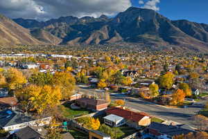 View of mountain background featuring nearby suburban area
