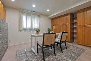Office area with recessed lighting and light colored carpet