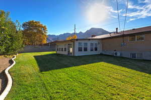 Rear view of house with a mountain view