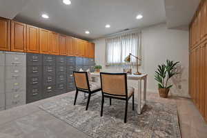 Office space with recessed lighting and baseboards