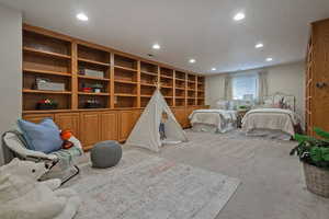 Carpeted bedroom featuring recessed lighting