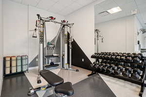 Workout area with a paneled ceiling