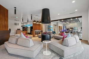 Living room with carpet floors and recessed lighting