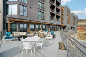View of patio featuring an outdoor living space with a fire pit and outdoor dining space
