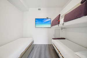 Bedroom featuring dark wood-style floors