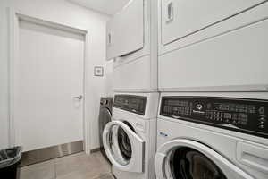 Laundry area with stacked washer / drying machine