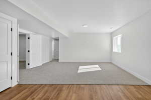 Unfurnished room with baseboards and light wood-type flooring