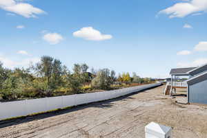 Fenced backyard featuring stairway