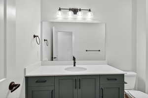 Bathroom with vanity and toilet