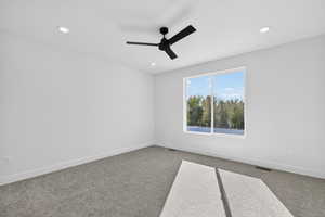 Spare room featuring carpet, recessed lighting, and ceiling fan