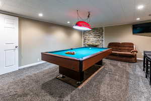 Game room with recessed lighting, crown molding, carpet flooring, billiards, and a stone fireplace
