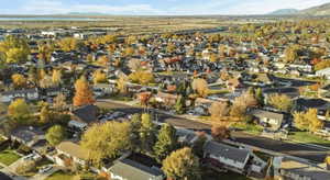 Aerial perspective of suburban area with a mountain backdrop