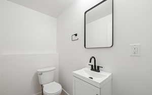 Bathroom featuring vanity and toilet