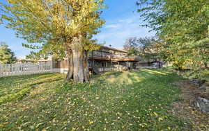 Back of house with a wooden deck