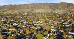 Aerial overview of property's location with nearby suburban area