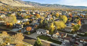 Aerial view of residential area featuring a mountain backdrop