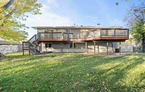 Back of house featuring a deck and stairs