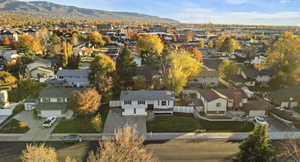 Aerial view of residential area featuring a mountainous background