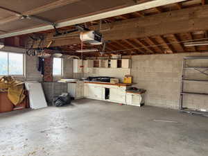 Garage featuring a garage door opener