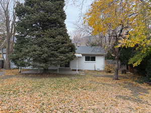 View of side of property with a patio area and crawl space