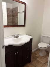 Full bathroom featuring vanity and a shower