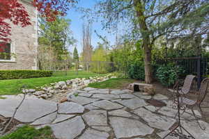 Fenced backyard with a patio area