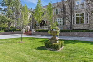 View of property's community featuring a lawn