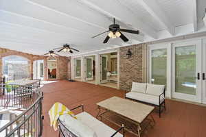 View of patio with ceiling fan, an outdoor living space, outdoor dining area, and french doors