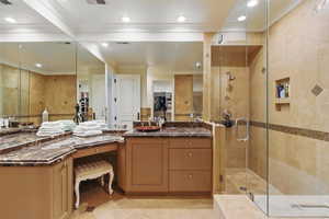Full bathroom with a stall shower, ornamental molding, vanity, recessed lighting, and a spacious closet