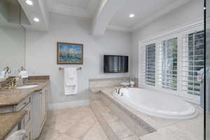 Bathroom featuring vanity, crown molding, a garden tub, recessed lighting, and beamed ceiling