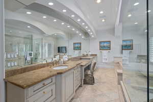Full bath featuring ornamental molding, vanity, a stall shower, light tile patterned flooring, and recessed lighting