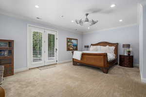 Bedroom featuring crown molding, access to outside, light colored carpet, recessed lighting, and ceiling fan