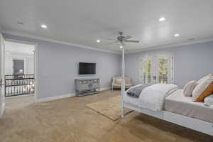 Bedroom with ornamental molding, light colored carpet, recessed lighting, a ceiling fan, and access to exterior