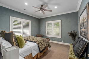 Bedroom with crown molding, carpet, a ceiling fan, and recessed lighting