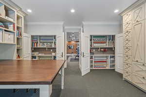 Office space featuring crown molding and recessed lighting