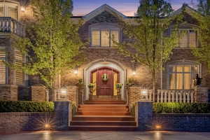 View of exterior entry with brick siding