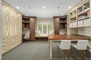 Office featuring built in study area, light carpet, crown molding, and recessed lighting