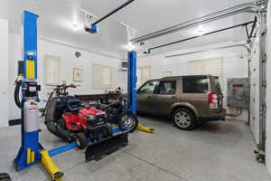 Garage featuring a garage door opener