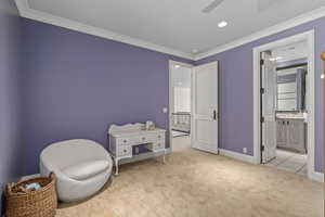 Sitting room with light carpet, ornamental molding, recessed lighting, and a ceiling fan
