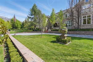 View of community featuring a lawn