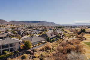 Aerial perspective of suburban area with a mountainous background