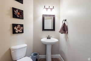 Bathroom featuring toilet and baseboards