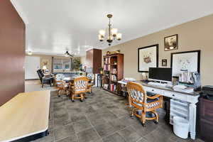 Office with ceiling fan, crown molding, a chandelier, and dark tile patterned floors