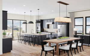 Dining space with light wood-style floors, spacious kitchen, and 10ft ceilings.